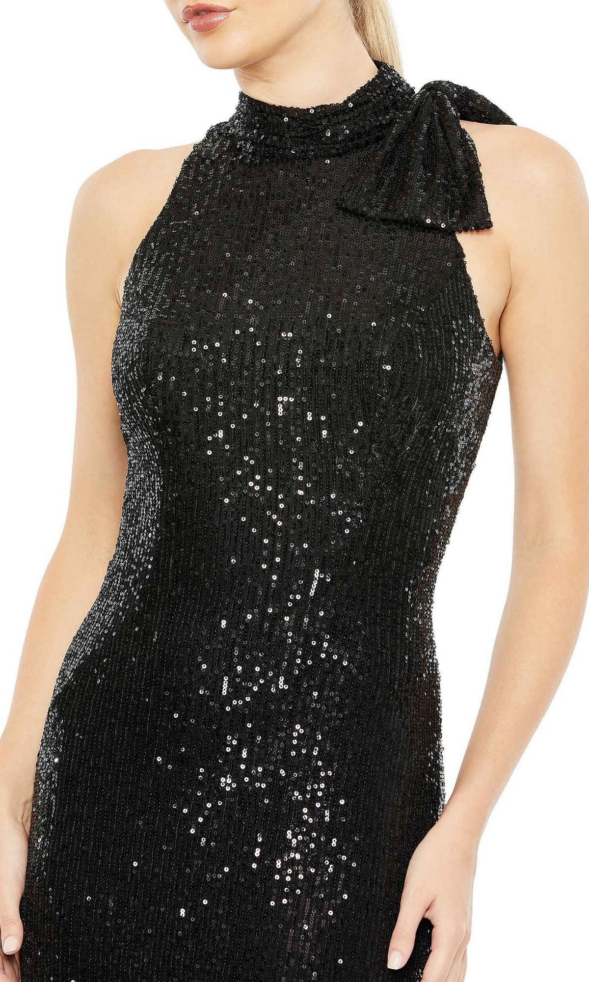 A woman wears the Mac Duggal 11280 Bow Long Sequin Formal Dress—a sleeveless, black gown with a high neckline and bold shoulder bow—ideal for an elegant evening look.